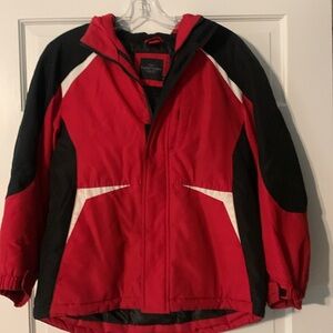 Red/ black boys jacket. Zipper and Velcro closure.
